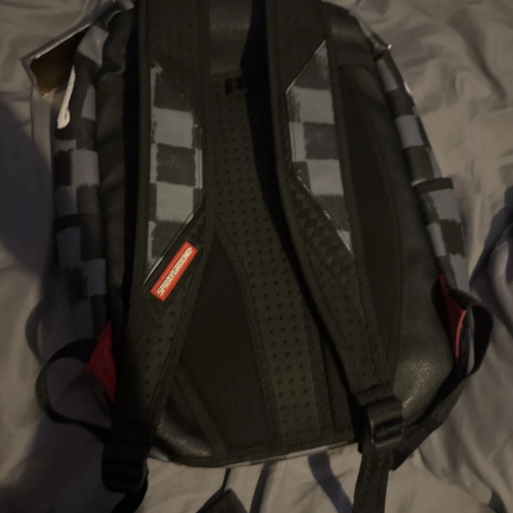 Black and grey sprayground backpack